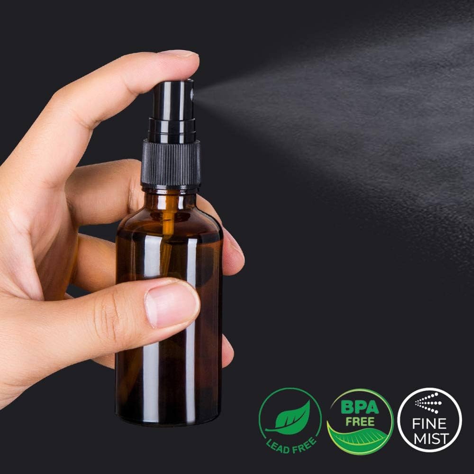 amber glass bottle spraying wild herb exclusive blend of pure essential oils