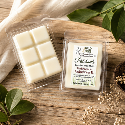 Packaged scented wax melts with a label on a wooden surface with leaves and flowers.