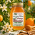 glass jar with gold cap filled with florida orange blossom pure raw honey from the original wild herb